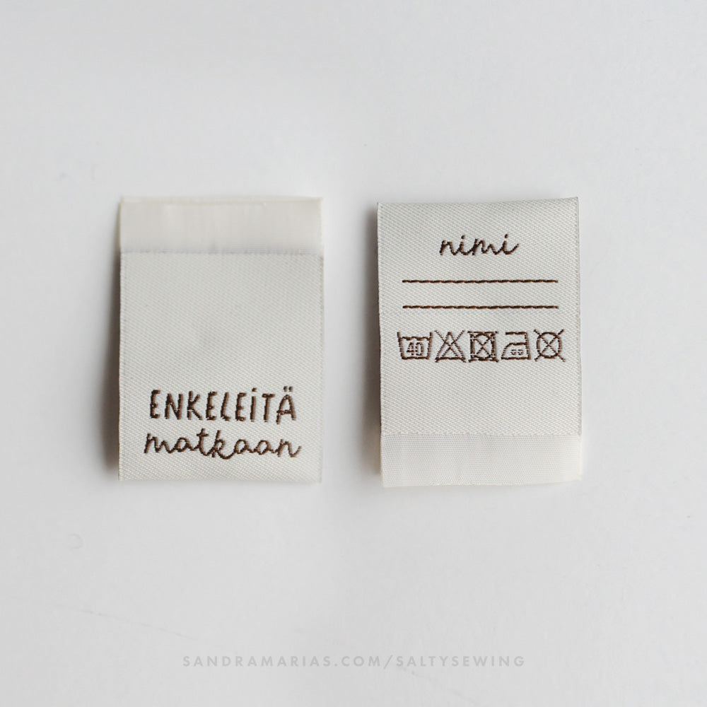 Woven label - Enkeleitä matkaan